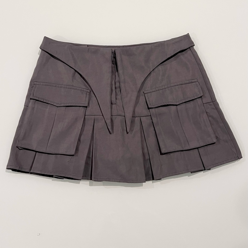 grey pleated mini skirt with pockets and attached shorts underneath